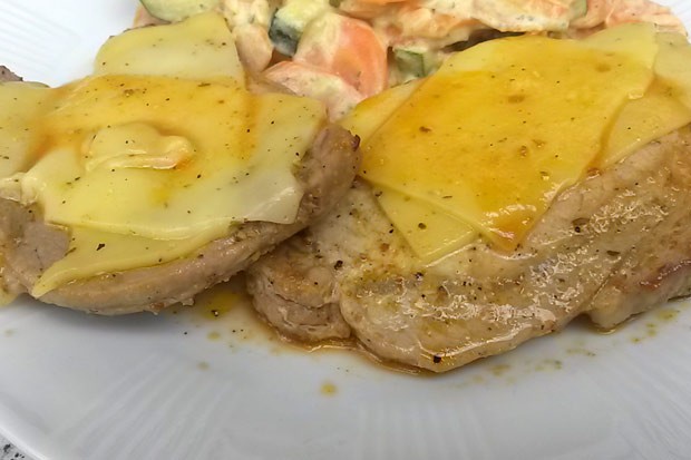 Pork chop topped with cheese