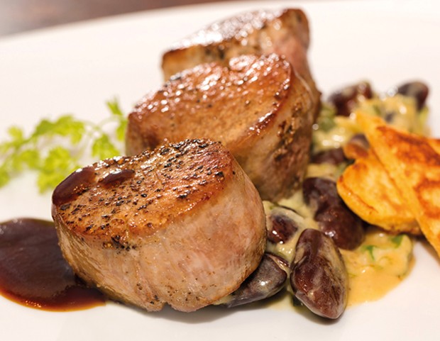 Pork tenderloin on creamy scarlet runner beans with polenta blinis.