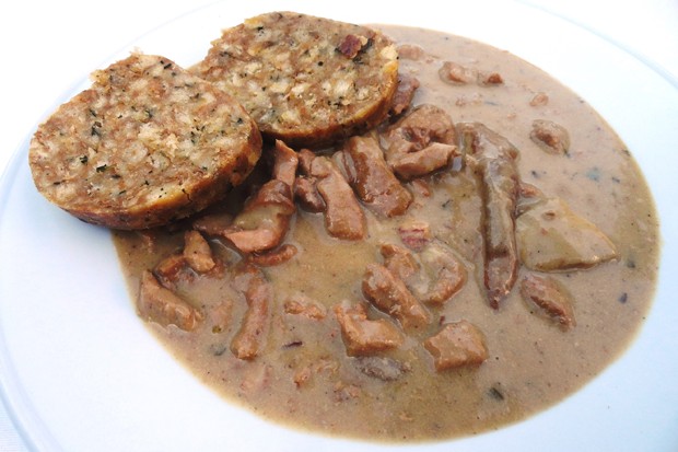 Sliced meat with mushrooms